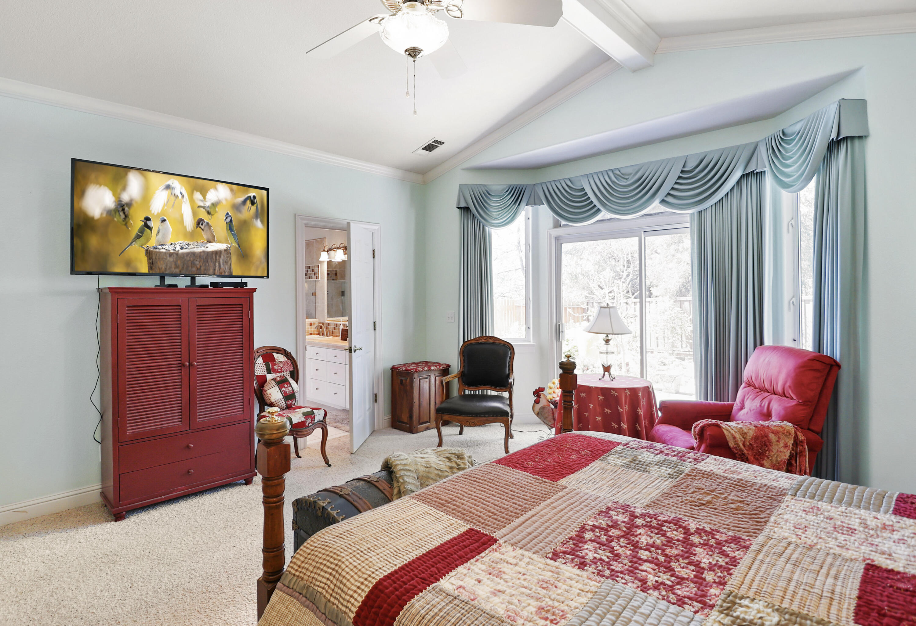 2210 Drexel Way Redding, CA 96001 - Photo 31 of 57 a bedroom with a bed and a flat screen tv