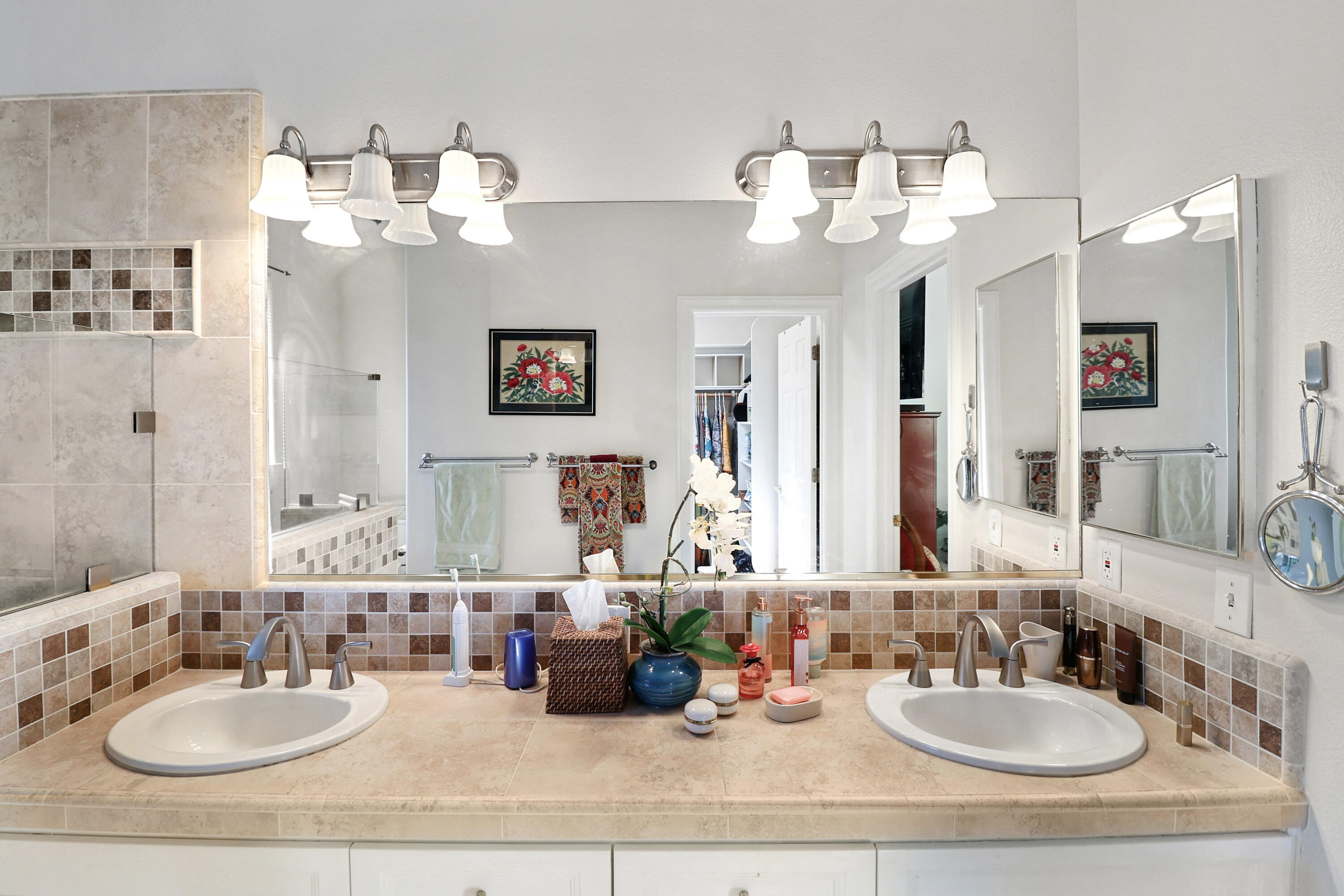 2210 Drexel Way Redding, CA 96001 - Photo 33 of 57 a bathroom with double vanity sinks a mirror and a lamp