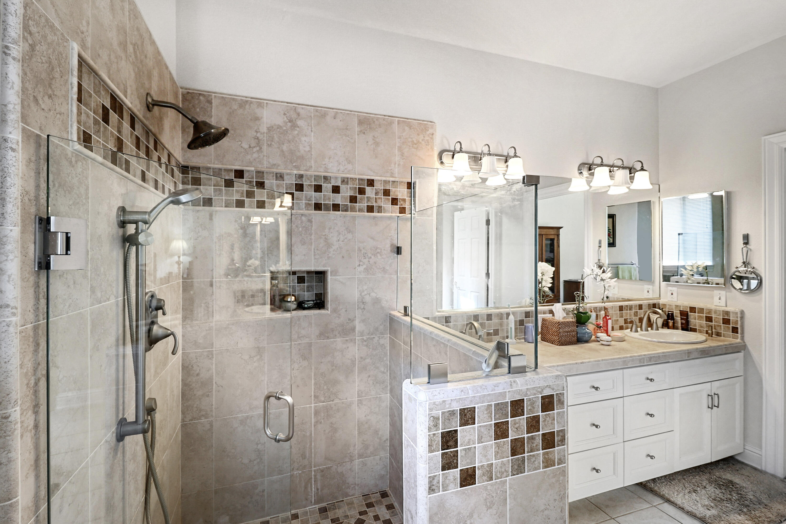 2210 Drexel Way Redding, CA 96001 - Photo 34 of 57 a spacious bathroom with double vanity sink a mirror a glass door a shower and vanity