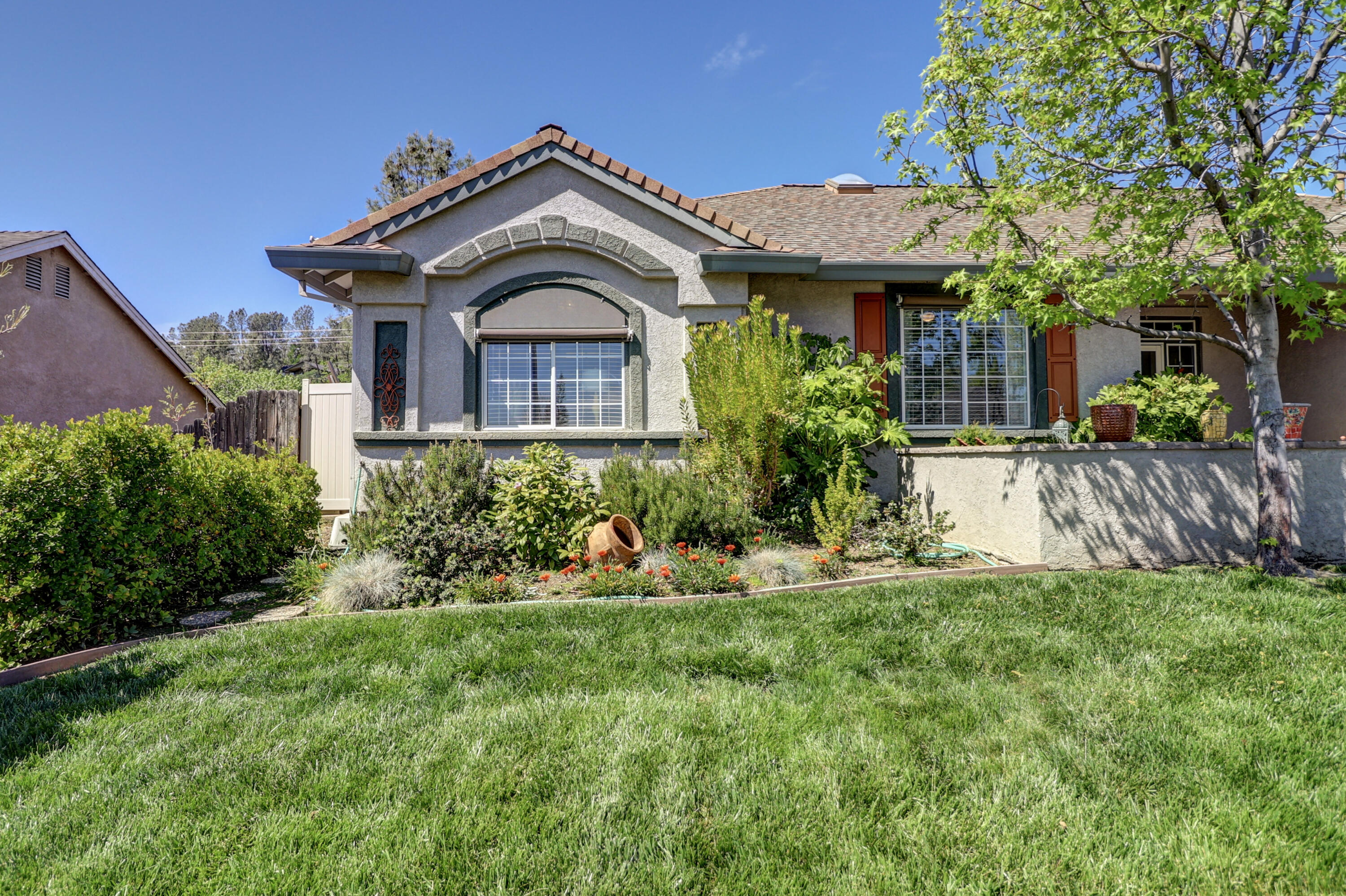 2210 Drexel Way Redding, CA 96001 - Photo 4 of 57 a front view of a house with a yard
