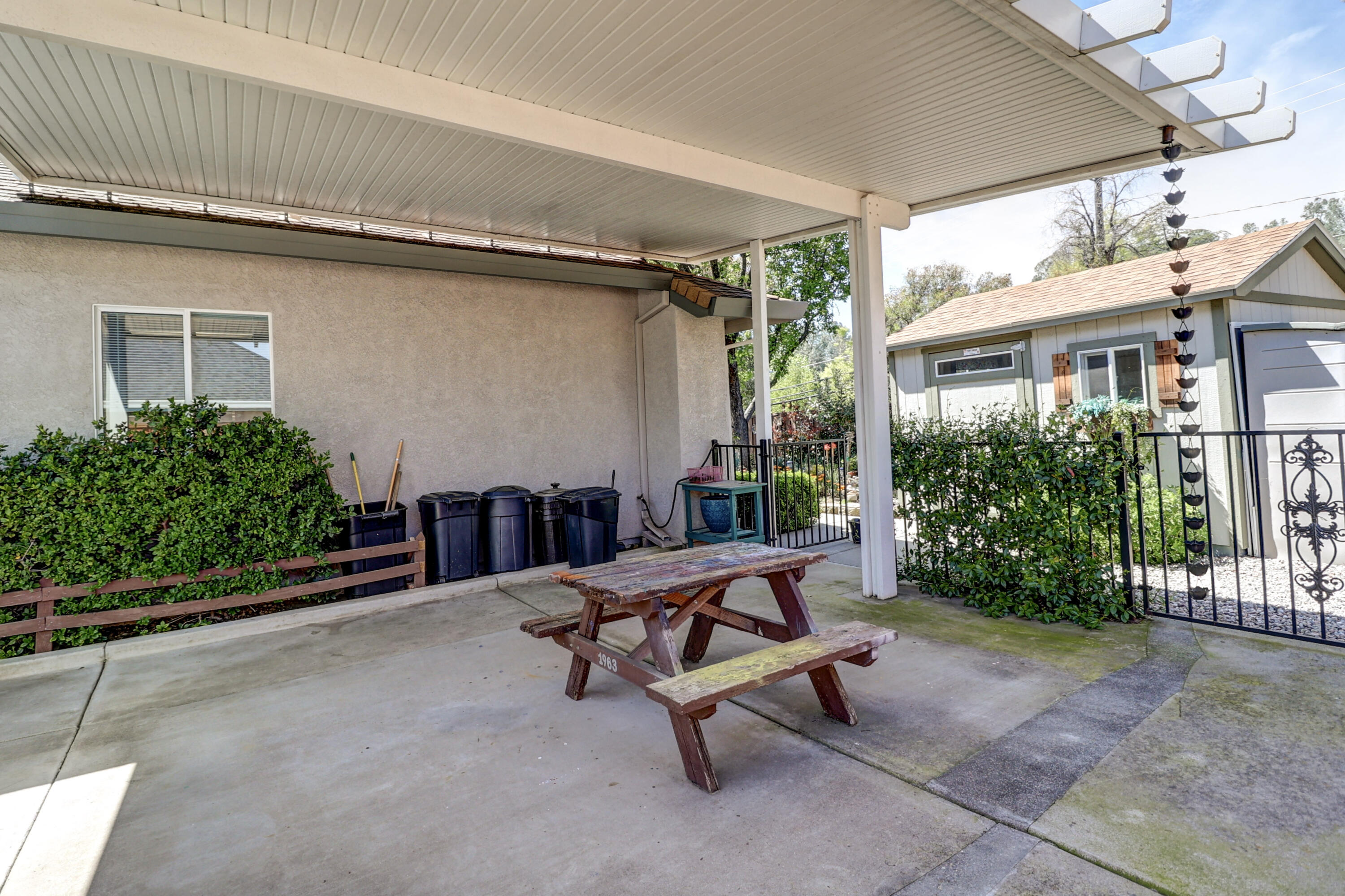 2210 Drexel Way Redding, CA 96001 - Photo 41 of 57 a view of a patio with a table and chairs