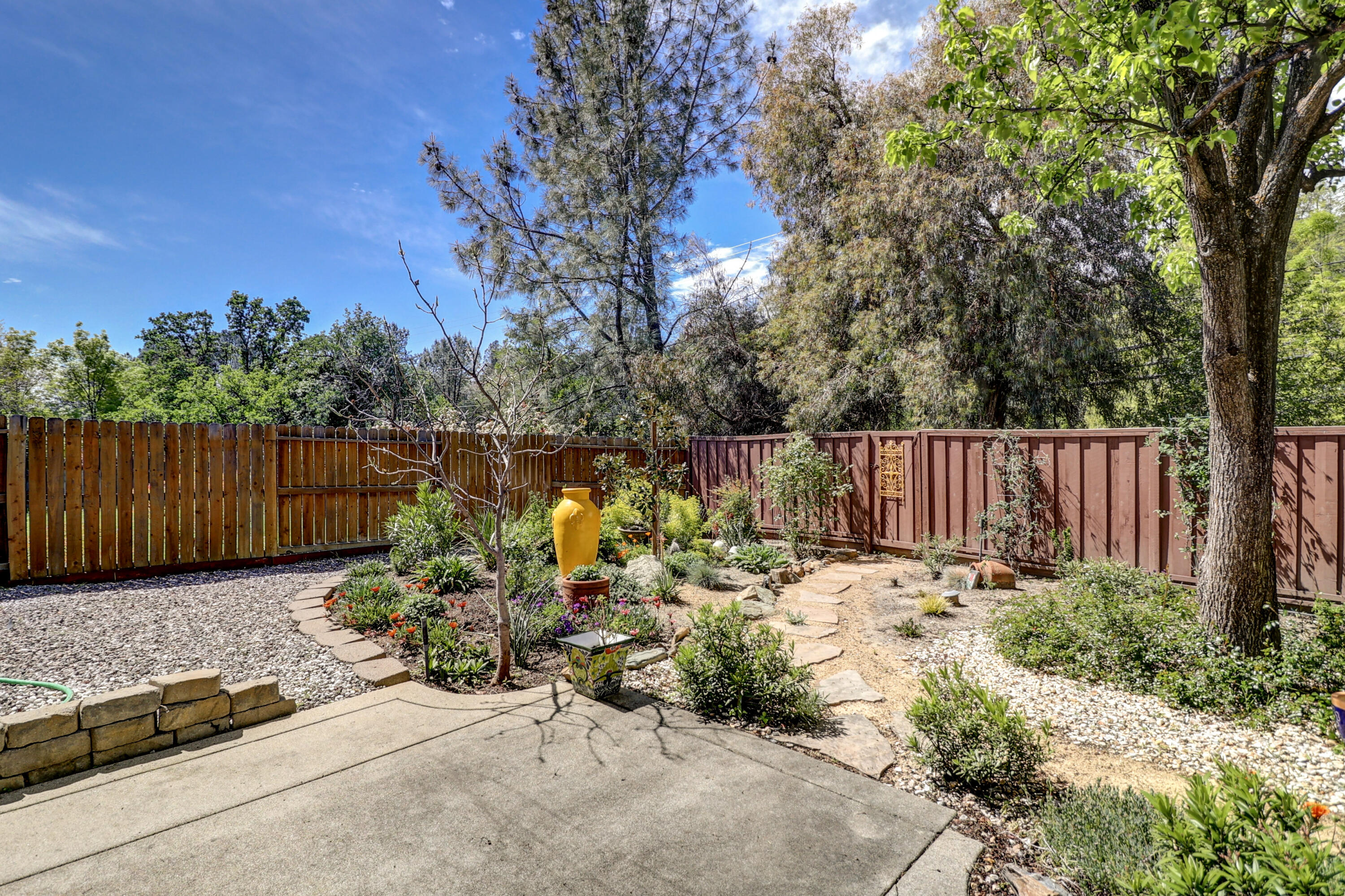 2210 Drexel Way Redding, CA 96001 - Photo 49 of 57 a backyard of a house with lots of green space