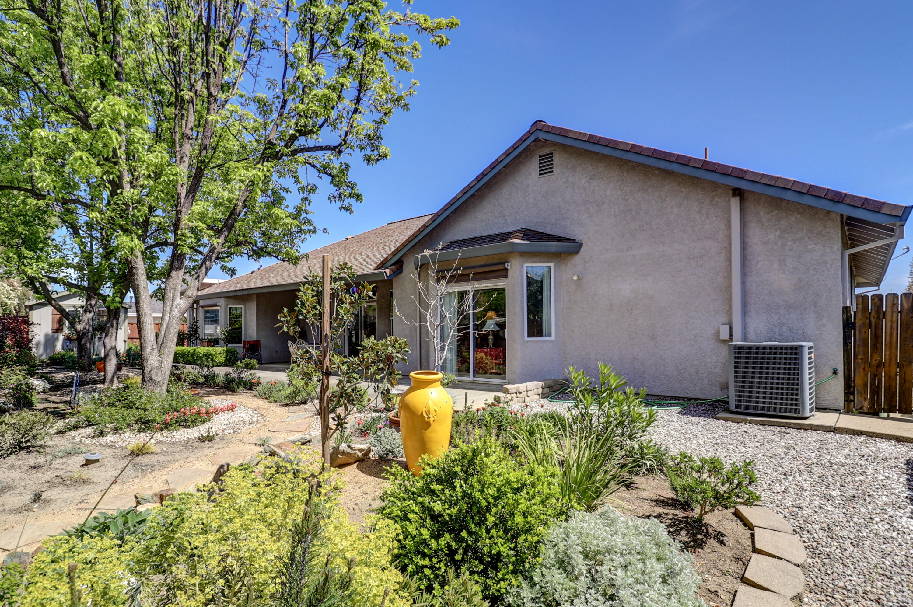 2210 Drexel Way Redding, CA 96001 - Photo 50 of 57 a front view of a house with a yard and seating space