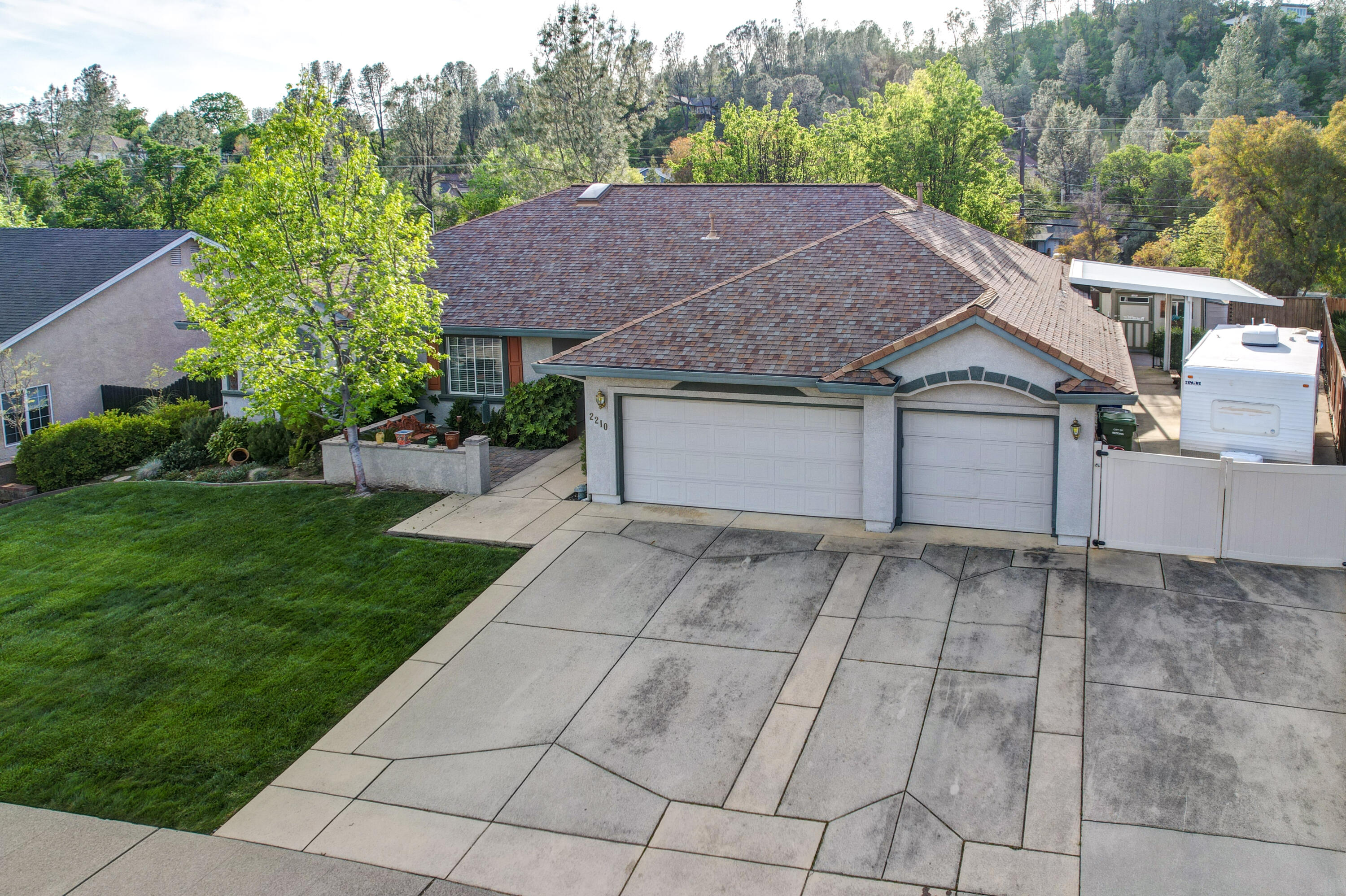 2210 Drexel Way Redding, CA 96001 - Photo 54 of 57 a house with trees in the background