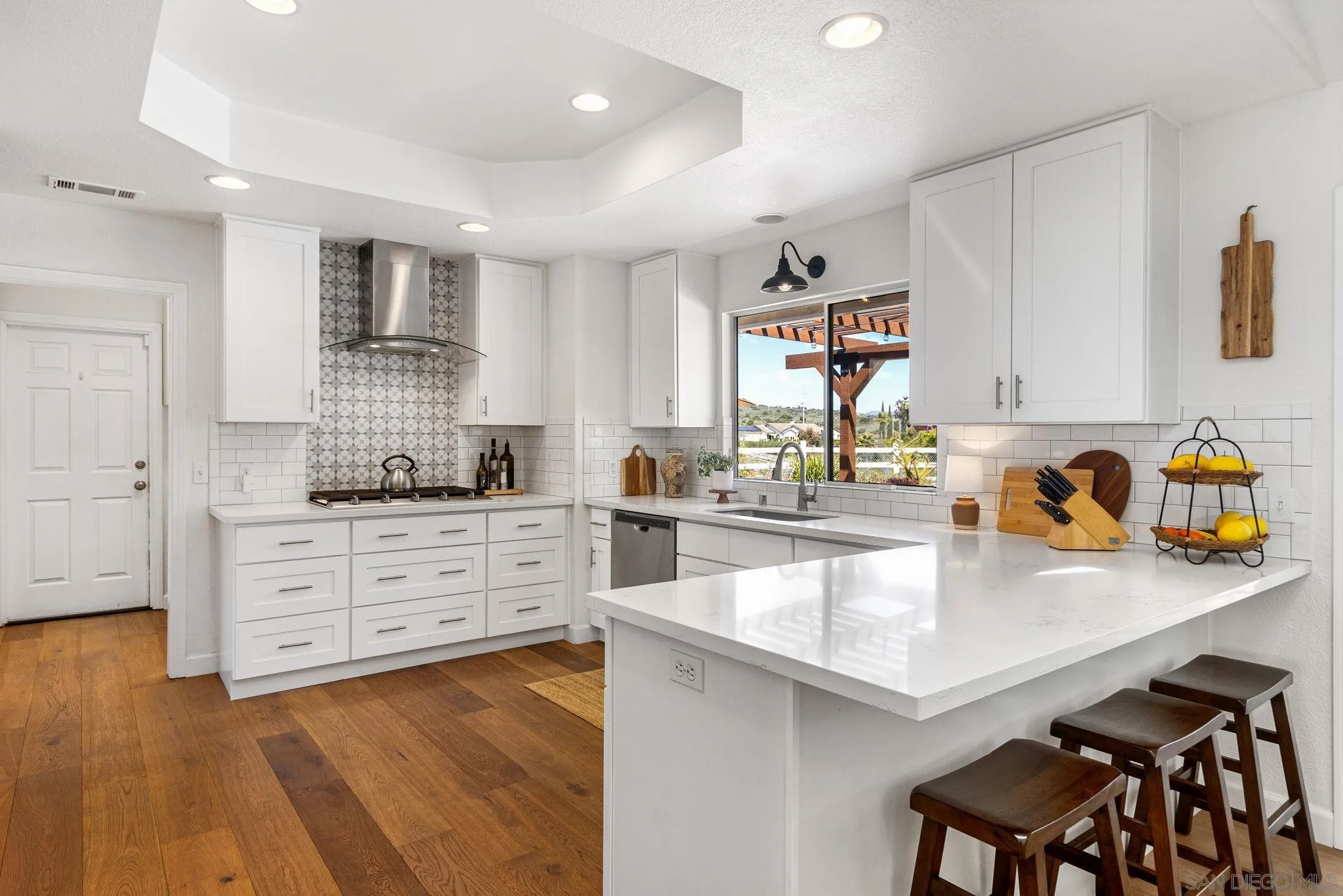 360 Futurity Lane Fallbrook, CA 92028 - Photo 11 of 58 a kitchen with white cabinets and appliances