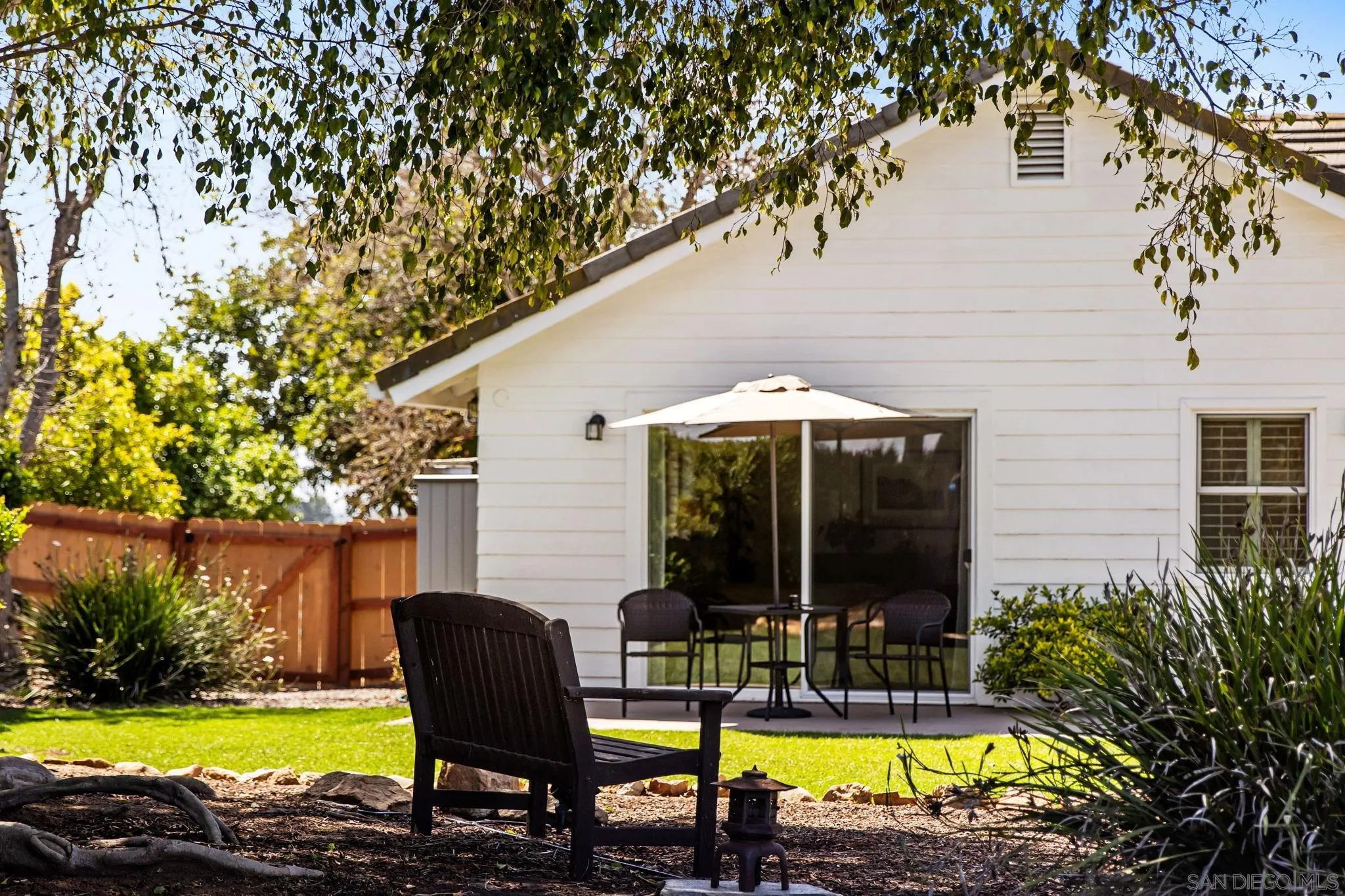 360 Futurity Lane Fallbrook, CA 92028 - Photo 20 of 58 a view of swimming pool with lawn chairs under an umbrella
