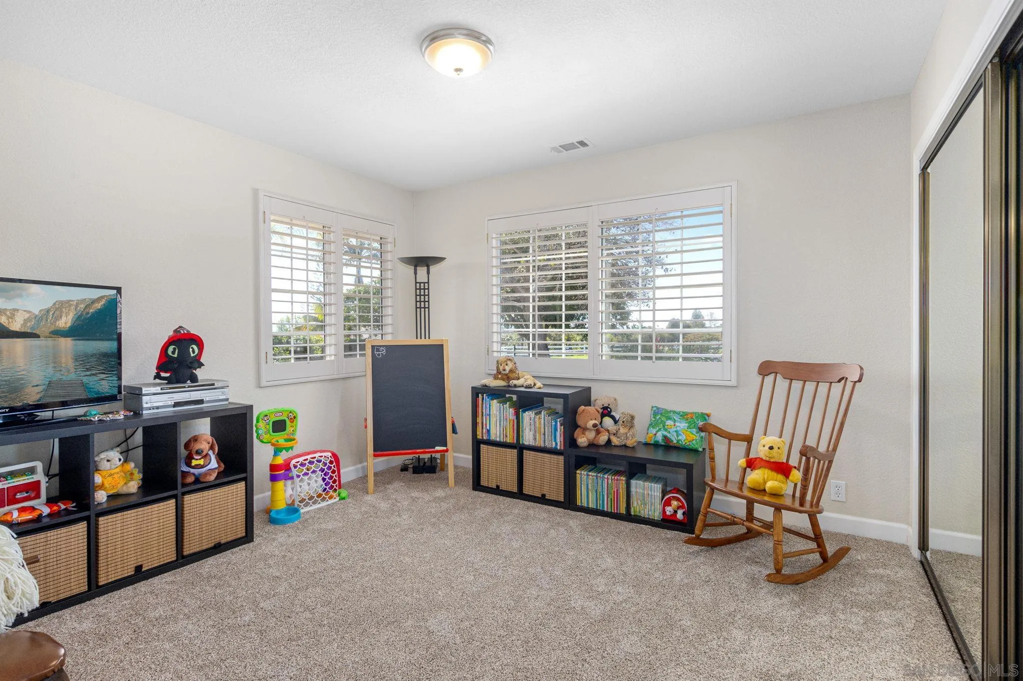 360 Futurity Lane Fallbrook, CA 92028 - Photo 26 of 58 a living room with furniture and a flat screen tv