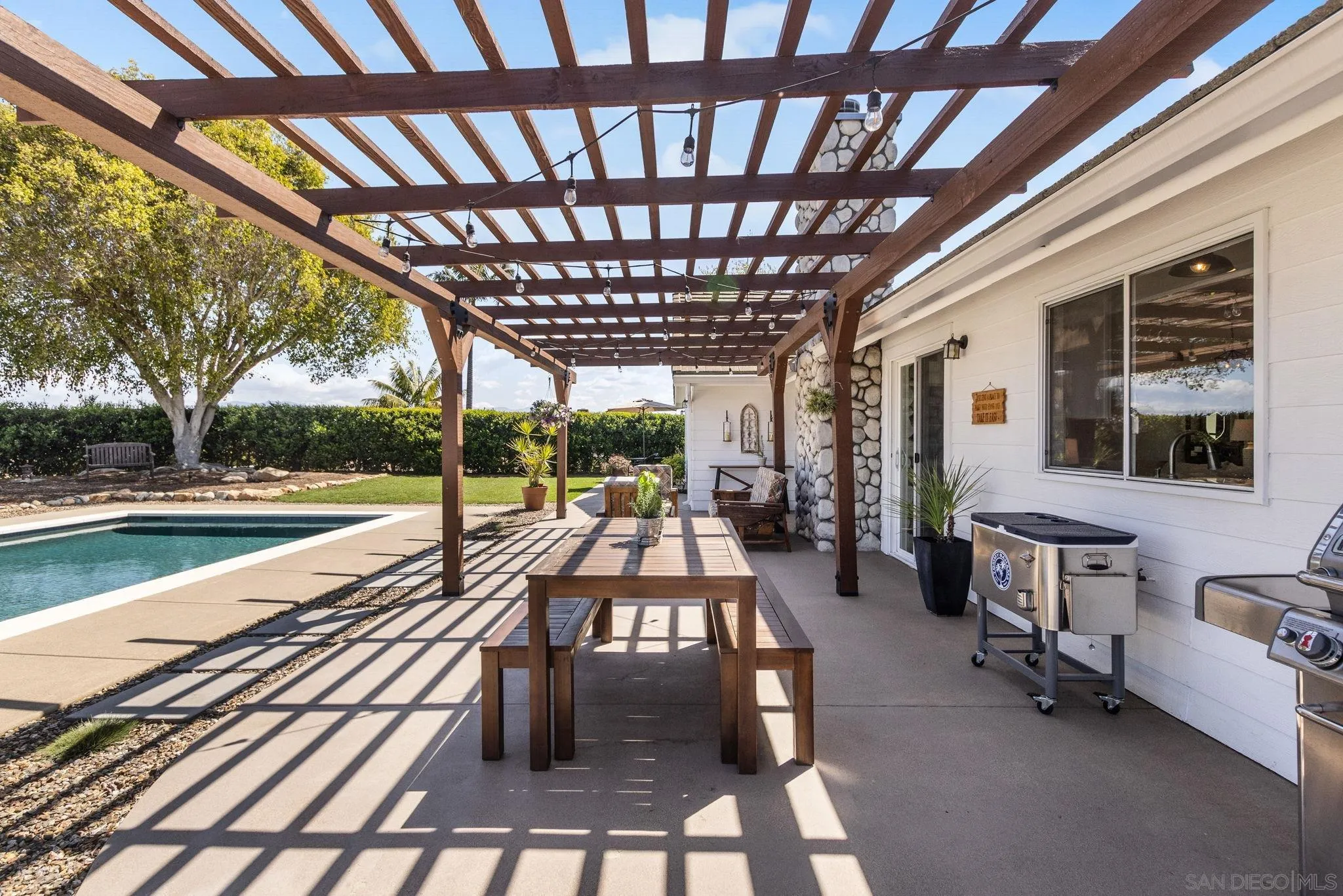 360 Futurity Lane Fallbrook, CA 92028 - Photo 31 of 58 a view of a patio with swimming pool table and chairs