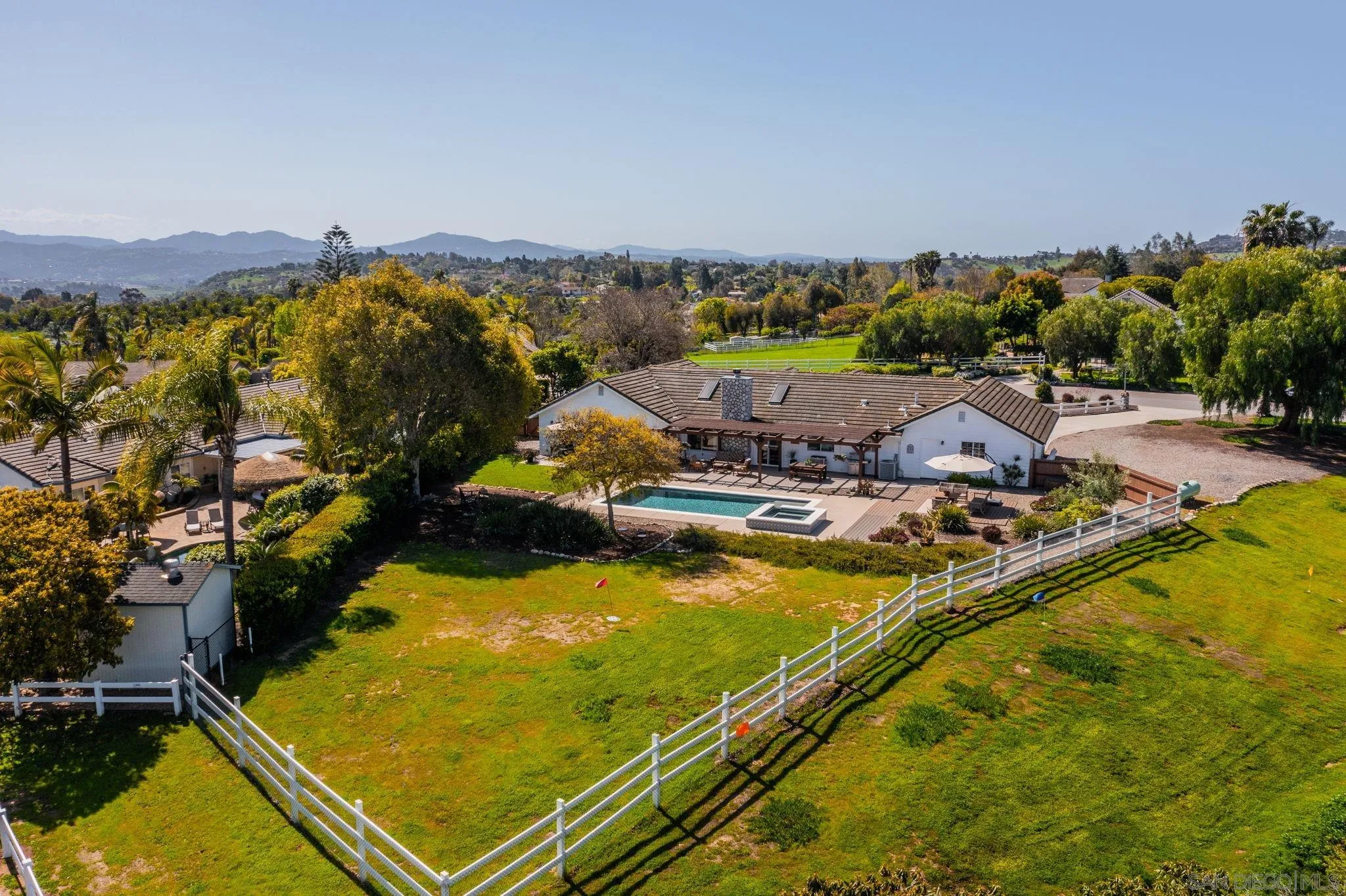 360 Futurity Lane Fallbrook, CA 92028 - Photo 45 of 58 a view of a swimming pool with a table and chairs