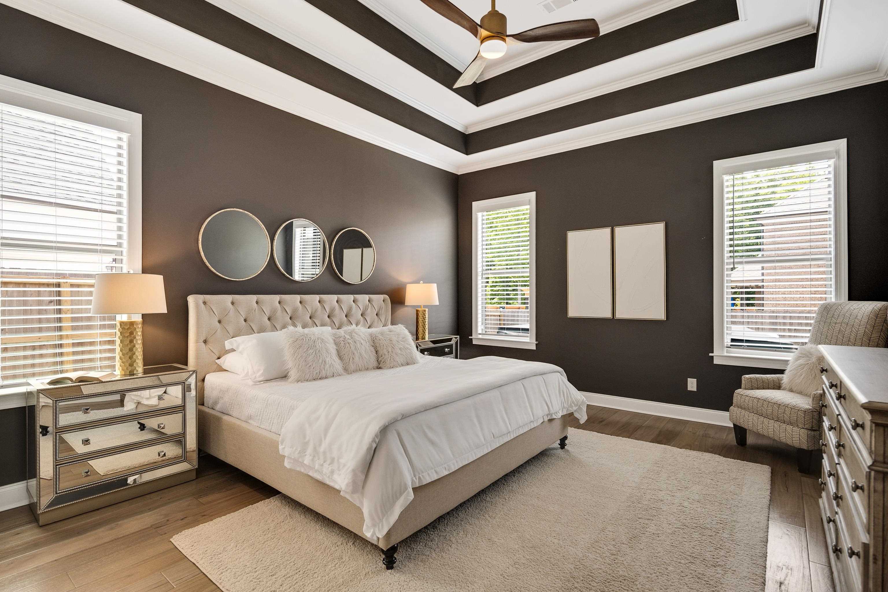 237 Beckham Drive Collierville, TN 38017 - Photo 16 of 40 Bedroom with ornamental molding, wood finished floors, baseboards, a tray ceiling, and a ceiling fan
