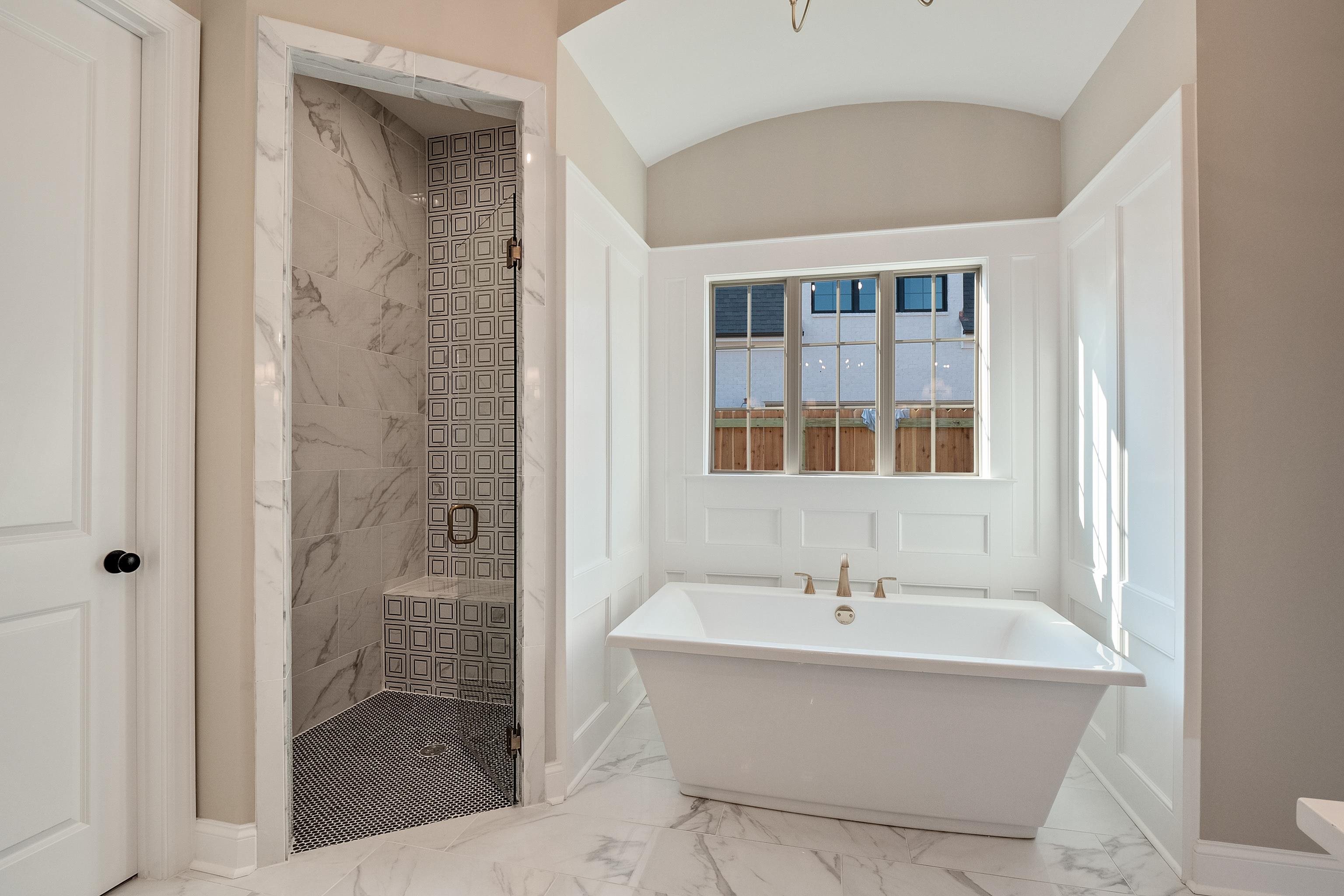 237 Beckham Drive Collierville, TN 38017 - Photo 18 of 40 Full bath featuring marble finish floor, a soaking tub, a shower stall, and baseboards