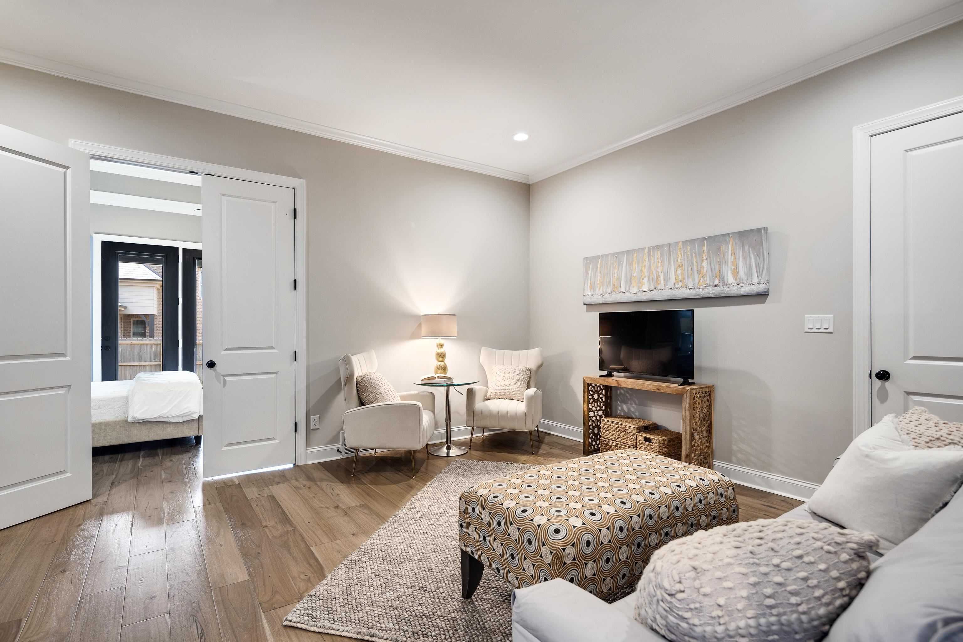 237 Beckham Drive Collierville, TN 38017 - Photo 27 of 40 Living area with wood finished floors, baseboards, ornamental molding, and recessed lighting