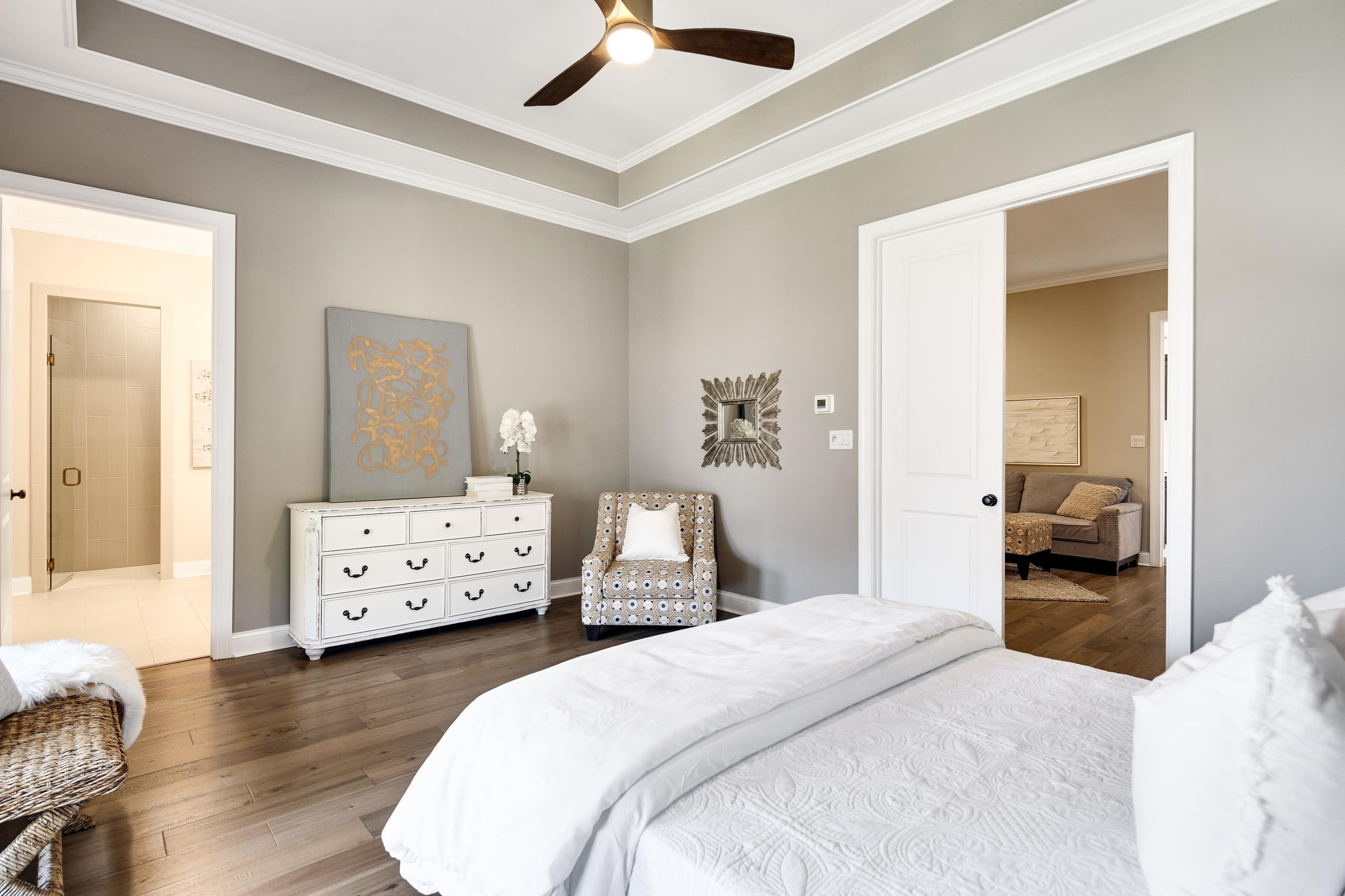 237 Beckham Drive Collierville, TN 38017 - Photo 30 of 40 Bedroom with hardwood / wood-style flooring, crown molding, baseboards, ensuite bathroom, and a ceiling fan