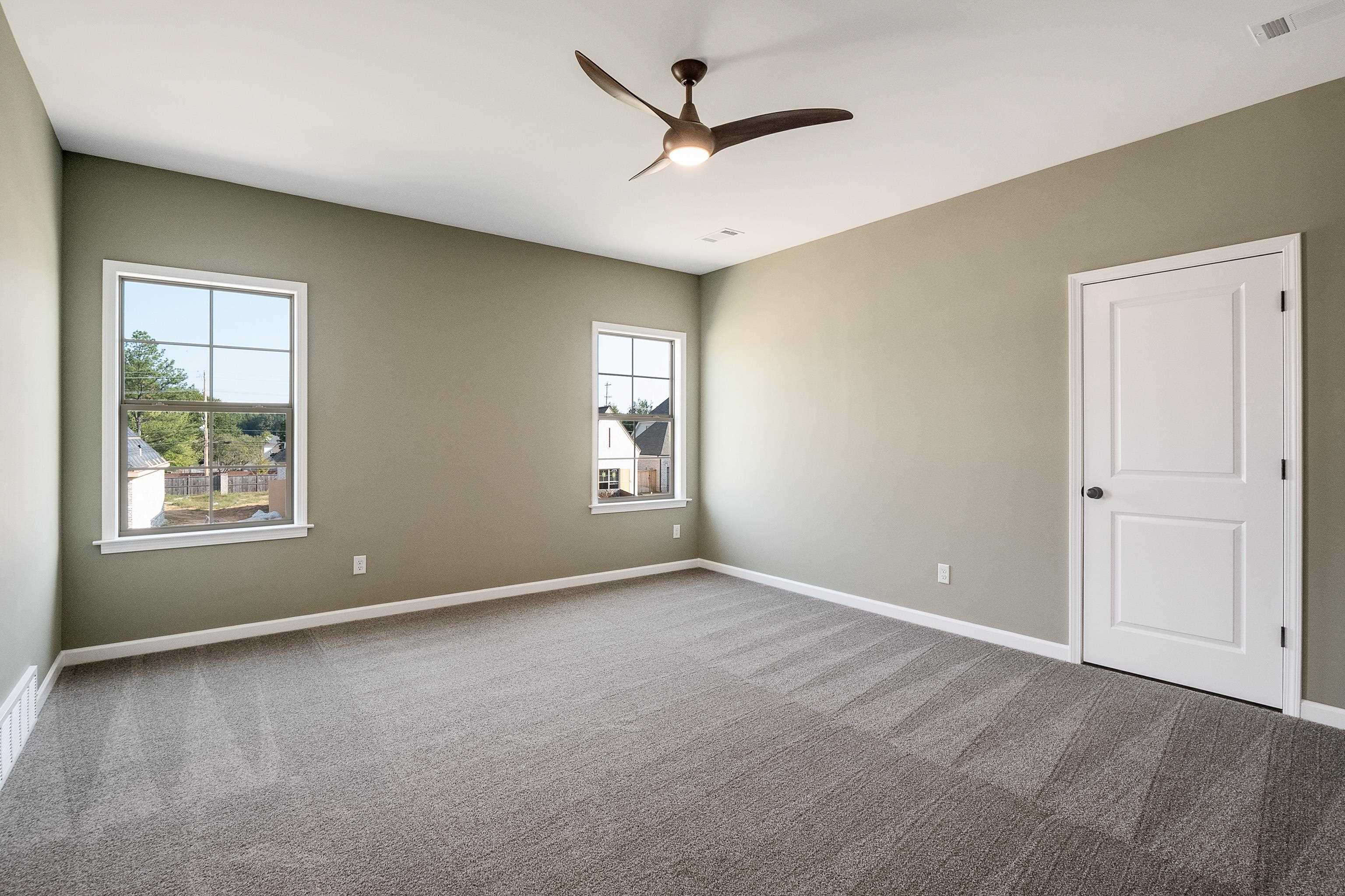237 Beckham Drive Collierville, TN 38017 - Photo 34 of 40 Carpeted empty room featuring ceiling fan, plenty of natural light, visible vents, and baseboards