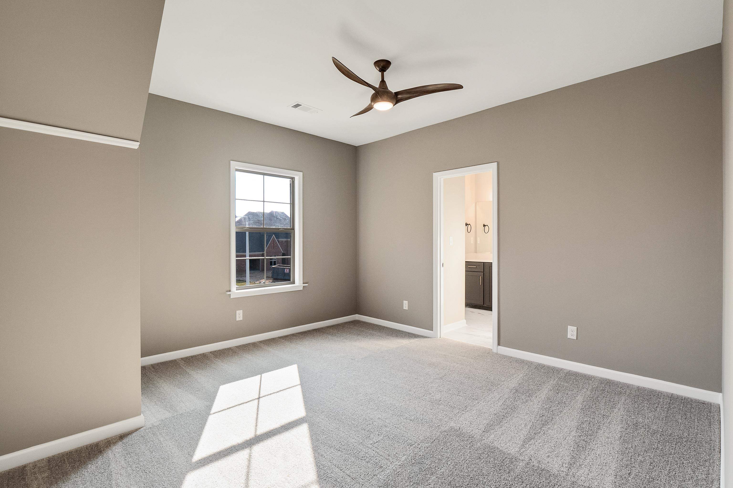 237 Beckham Drive Collierville, TN 38017 - Photo 35 of 40 Spare room featuring a ceiling fan, carpet, visible vents, and baseboards