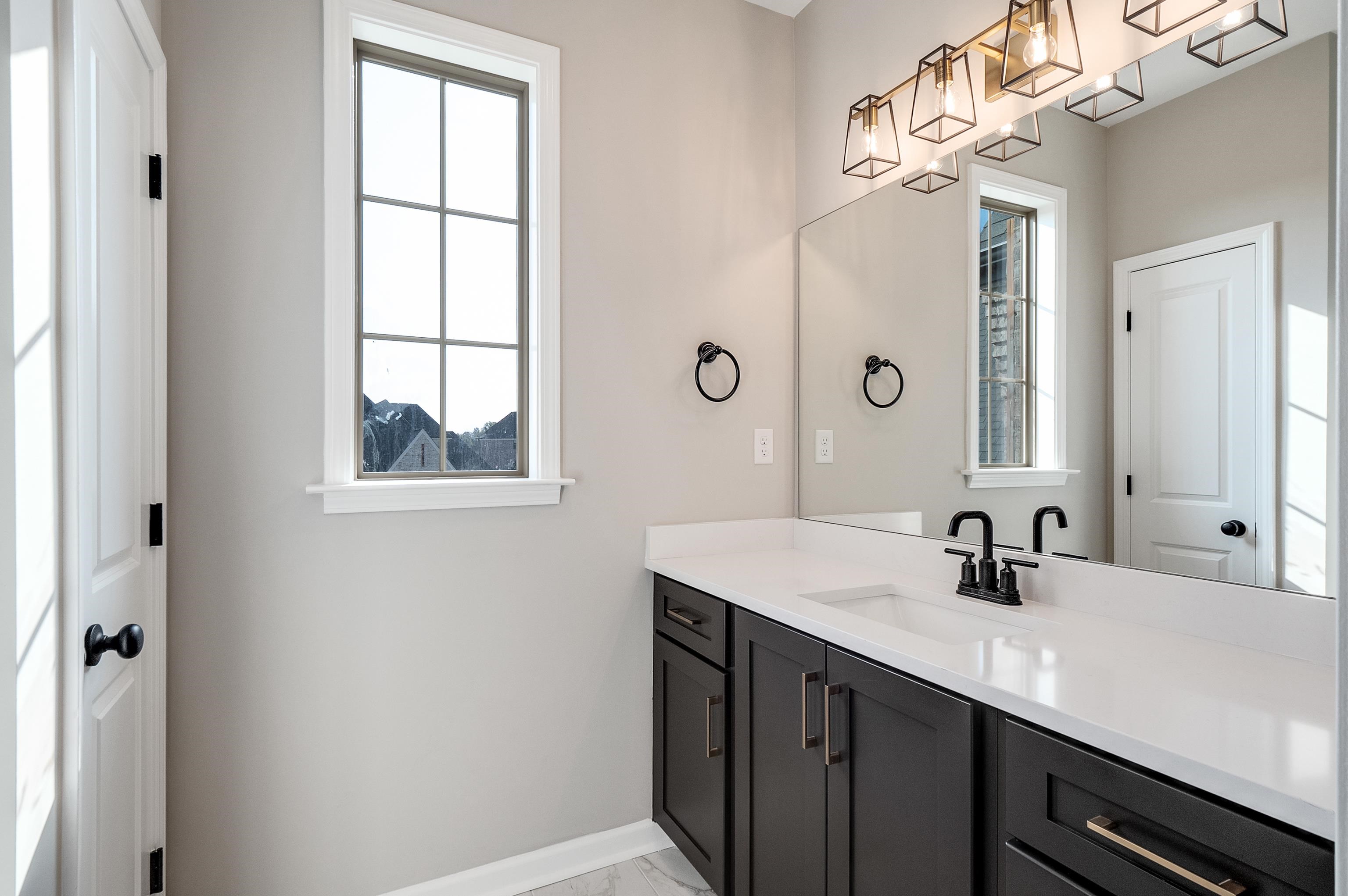 237 Beckham Drive Collierville, TN 38017 - Photo 36 of 40 Bathroom featuring marble finish floor, vanity, and baseboards