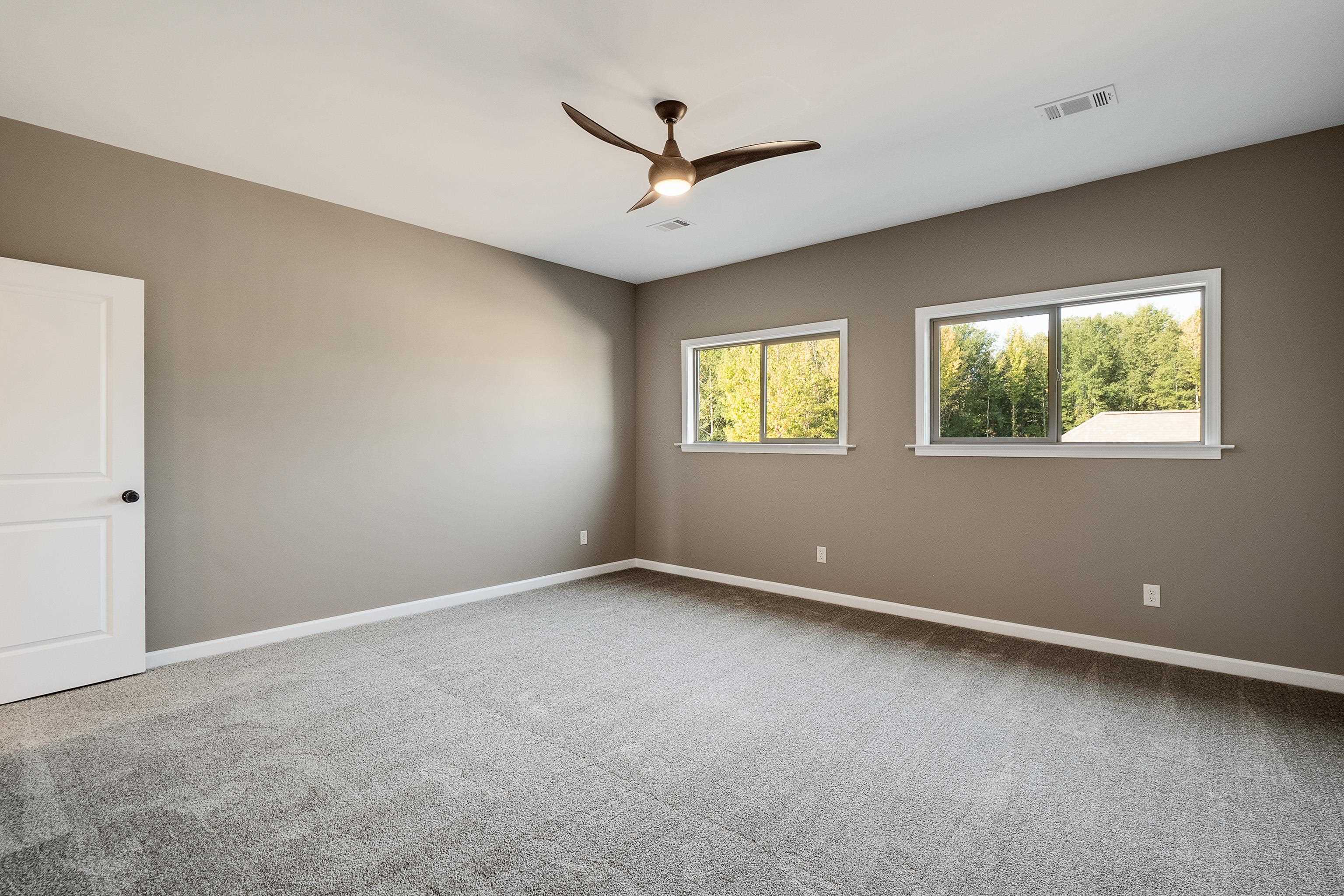 237 Beckham Drive Collierville, TN 38017 - Photo 37 of 40 Unfurnished room featuring ceiling fan, carpet floors, visible vents, and baseboards
