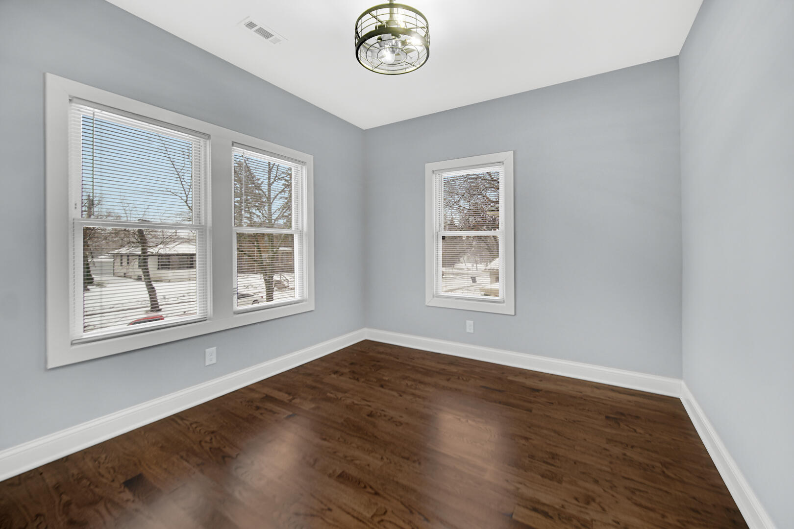 4354 Washington Street Gary, IN 46408 - Photo 16 of 32 a view of a big room with wooden floor and a window
