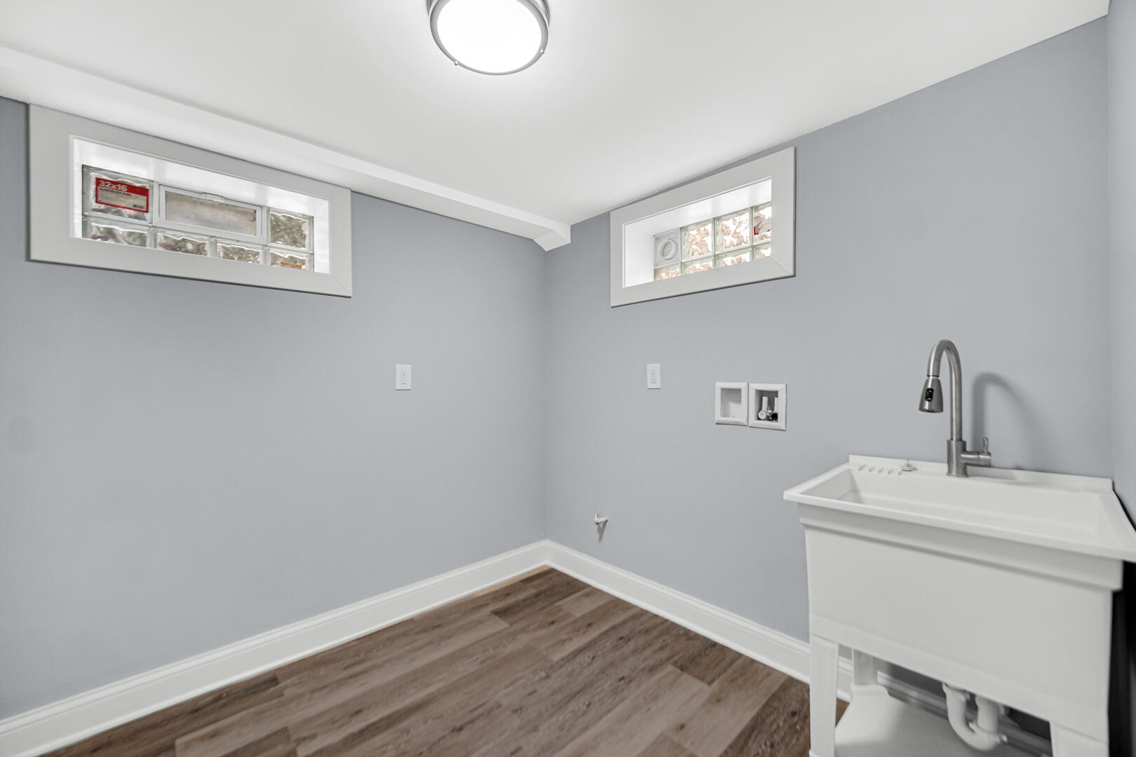 4354 Washington Street Gary, IN 46408 - Photo 28 of 32 a bathroom with a sink and a mirror