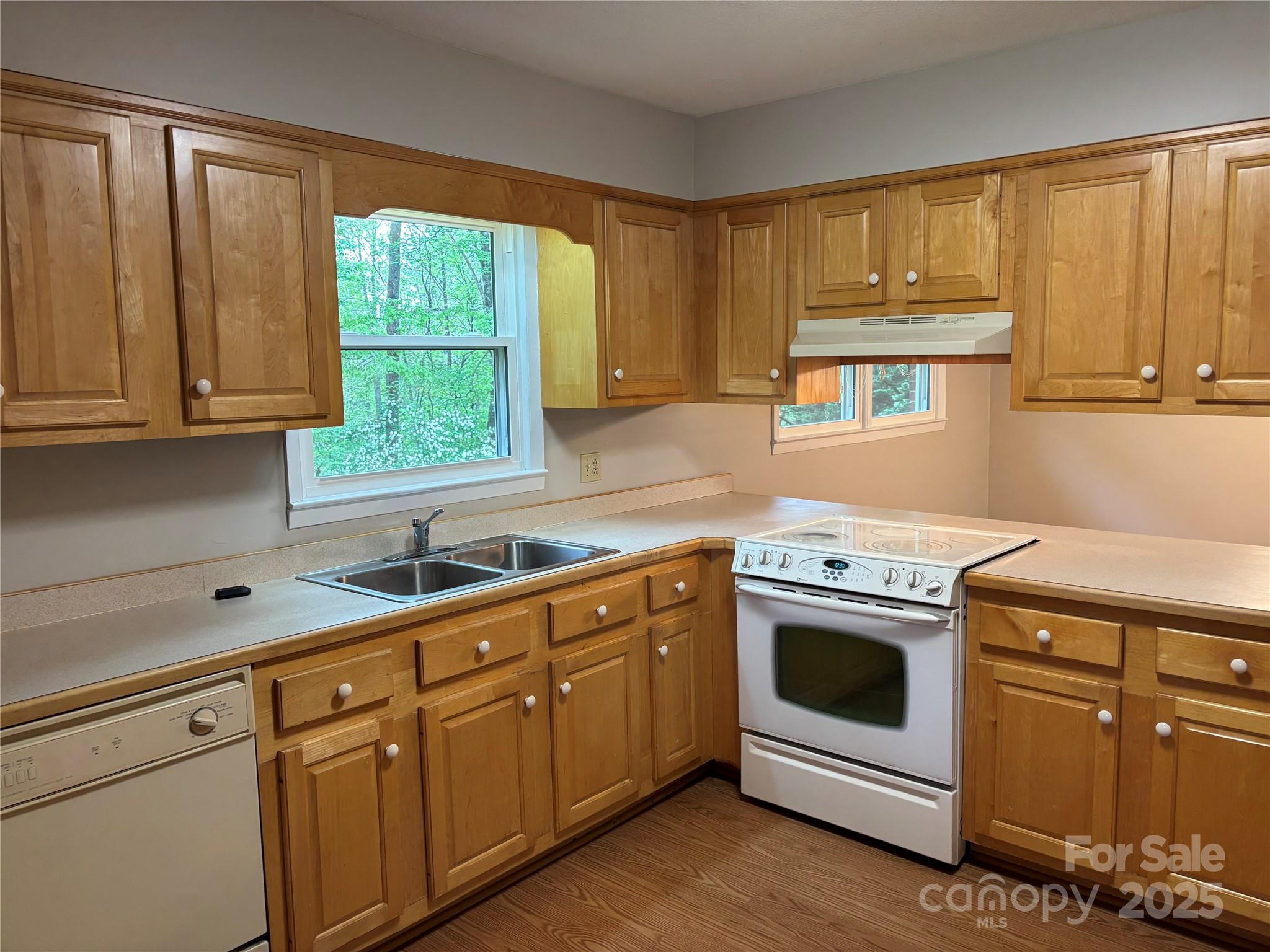 105 Cooper Drive Nebo, NC 28761 - Photo 4 of 17 a kitchen with stainless steel appliances granite countertop a stove a sink and a microwave