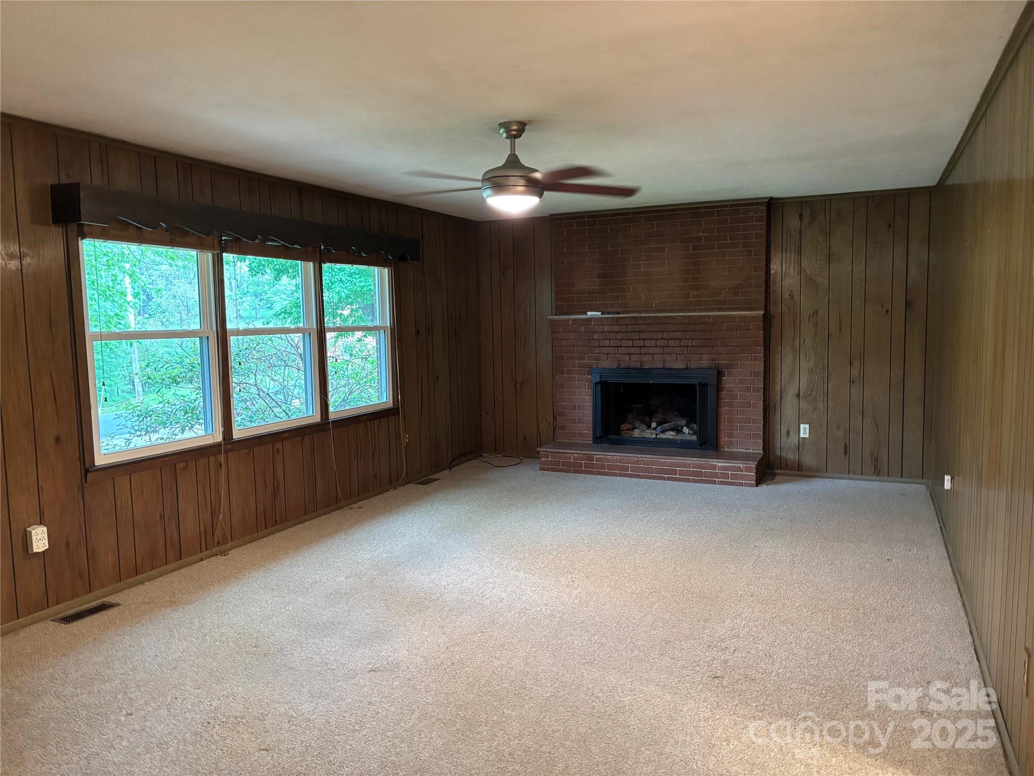 105 Cooper Drive Nebo, NC 28761 - Photo 8 of 17 wooden floor fireplace and window in an empty room