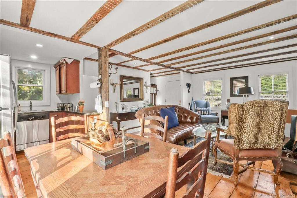 49 Hollow Tree Ridge Road Darien, CT 06820 - Photo 8 of 25 #49 - Main Level LR with Fireplace, dining area and Kitchen