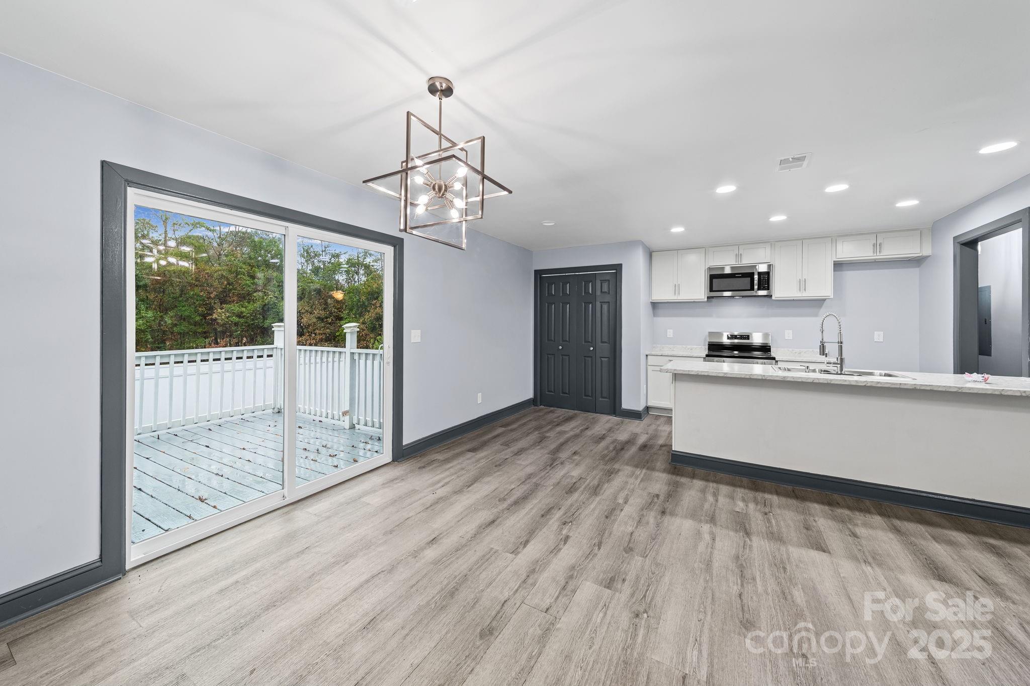 109 Haddock Road Northwest Orangeburg, SC 29115 - Photo 18 of 48 a view of a kitchen with wooden floor and outdoor space