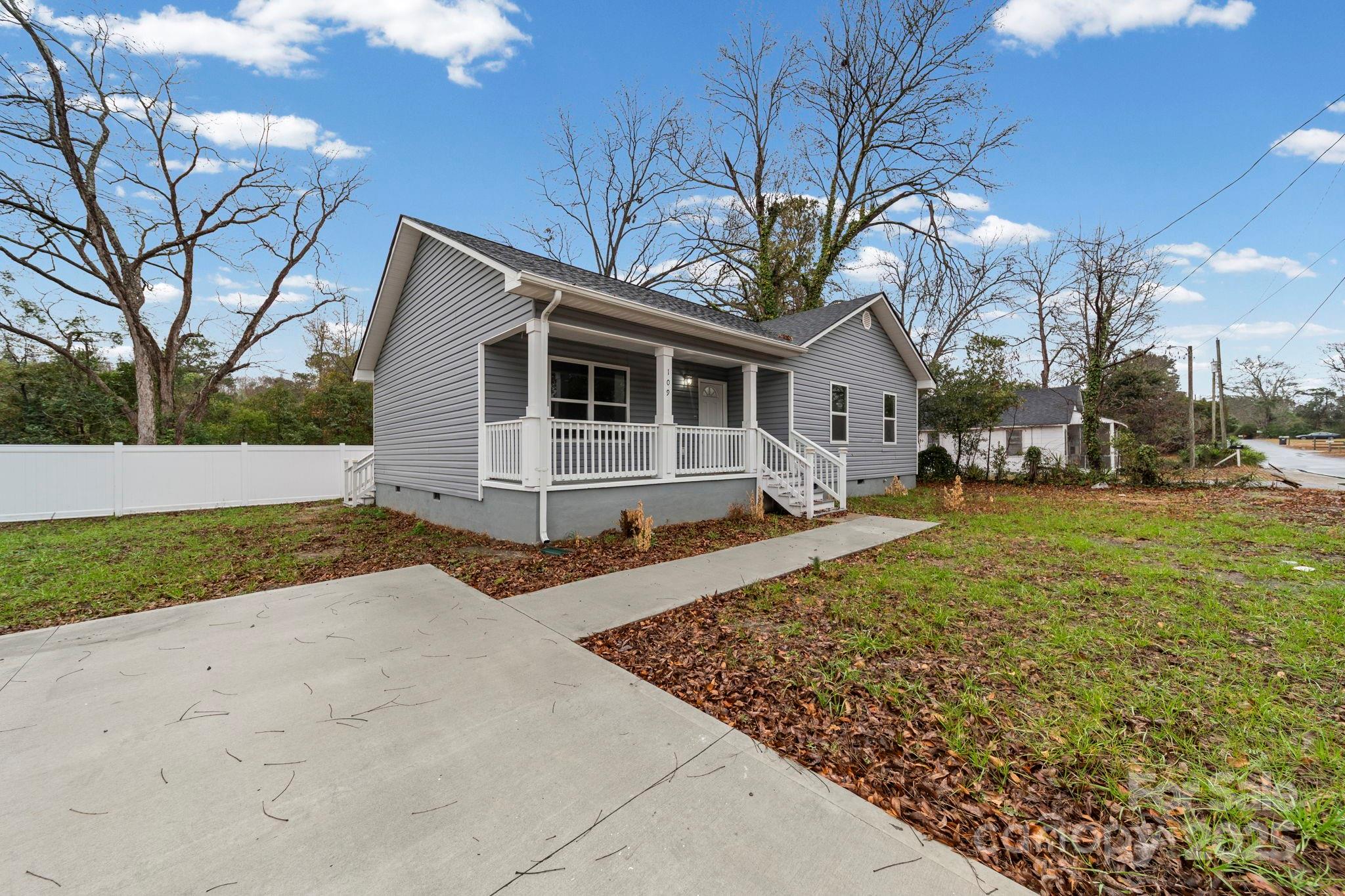 109 Haddock Road Northwest Orangeburg, SC 29115 - Photo 3 of 48 a front view of a house with a yard and garage
