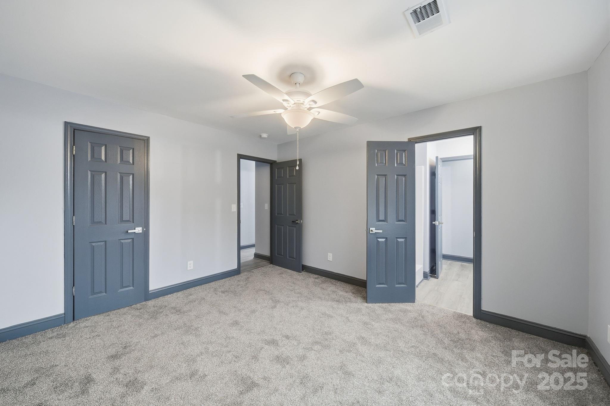 109 Haddock Road Northwest Orangeburg, SC 29115 - Photo 40 of 48 an empty room with closet and a ceiling fan