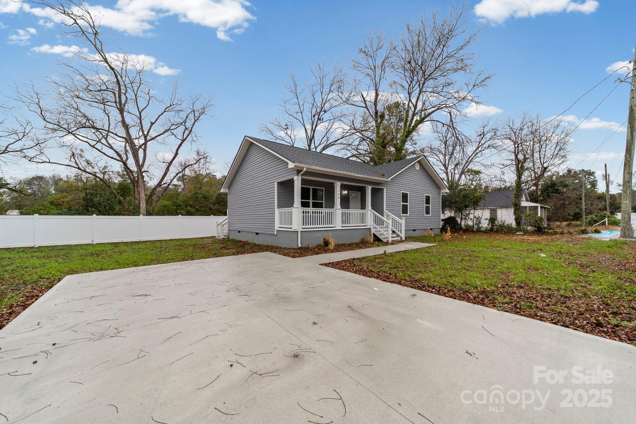 109 Haddock Road Northwest Orangeburg, SC 29115 - Photo 4 of 48 a front view of a house with a yard and garage