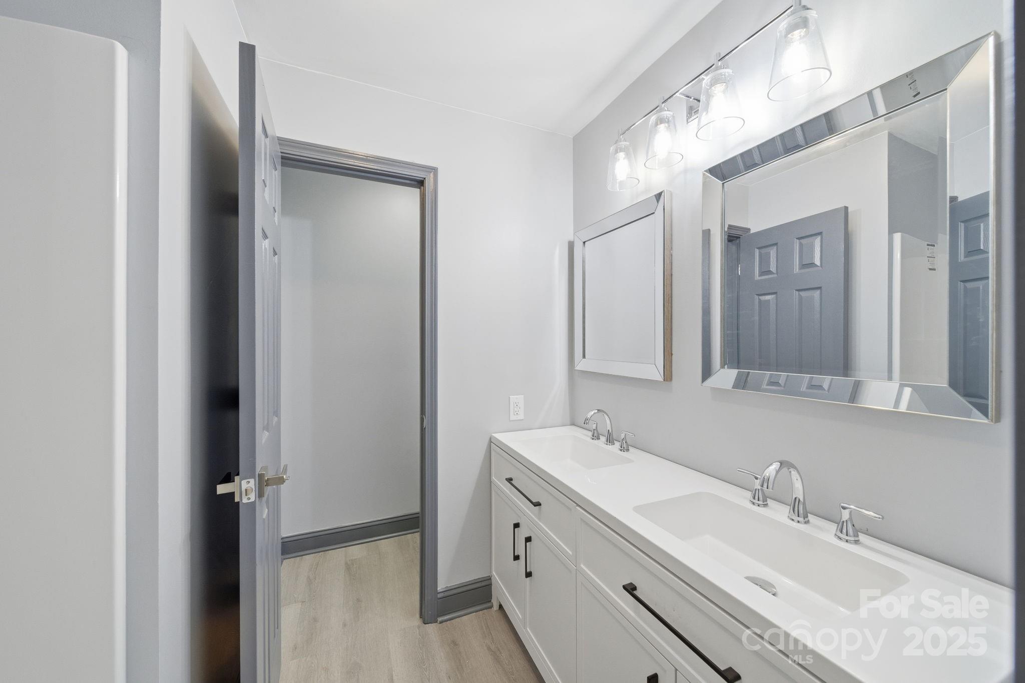 109 Haddock Road Northwest Orangeburg, SC 29115 - Photo 42 of 48 a bathroom with a double vanity sink mirror and double