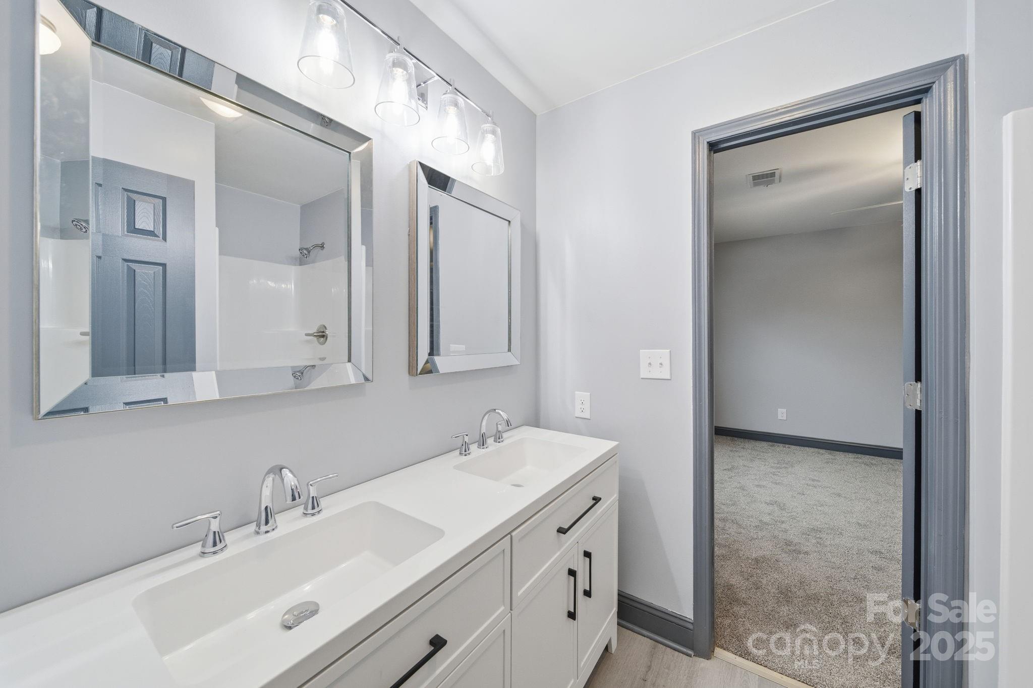 109 Haddock Road Northwest Orangeburg, SC 29115 - Photo 43 of 48 a bathroom with a double vanity sink mirror and