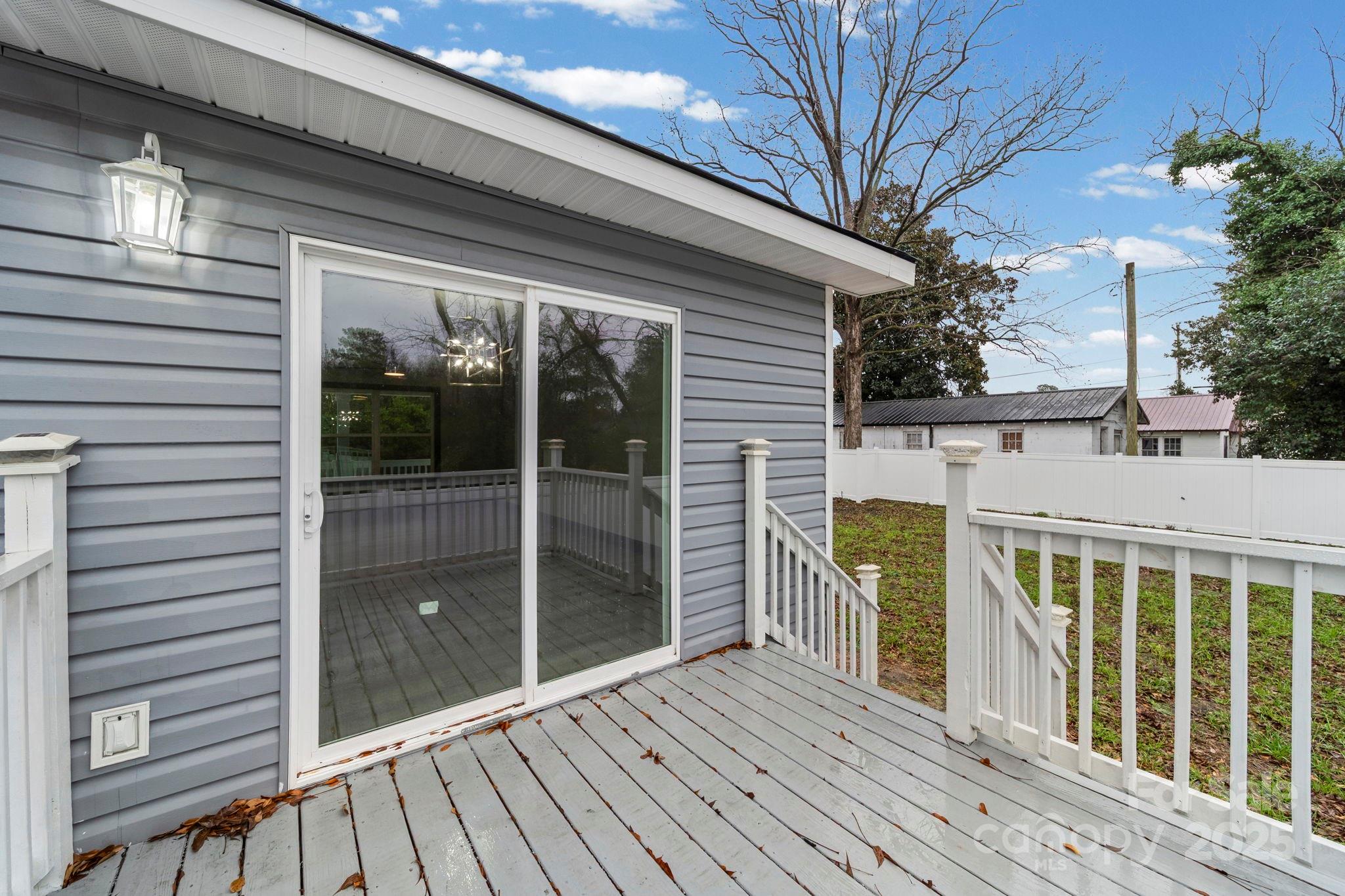 109 Haddock Road Northwest Orangeburg, SC 29115 - Photo 10 of 48 a view of a balcony with wooden floor and fence