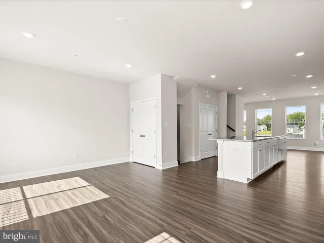 a view of kitchen with furniture and wooden floor