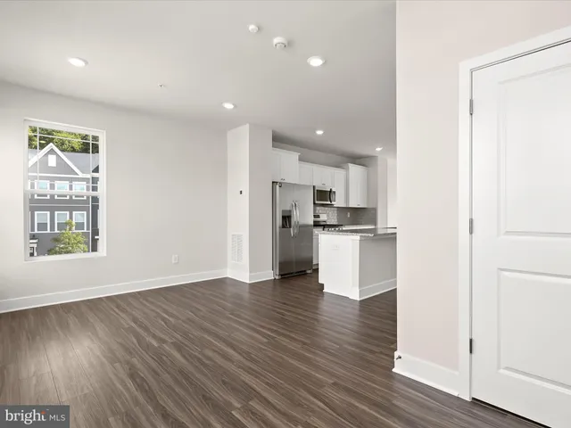 a view of kitchen view wooden floor and window