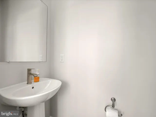a bathroom with a sink and a window