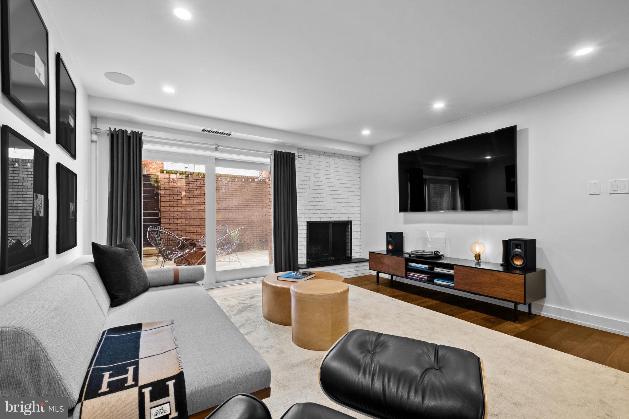 502 Delancey Street, Unit A Philadelphia, PA 19106 - Photo 14 of 32 a living room with furniture and a flat screen tv