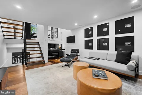a bedroom with furniture and a flat screen tv
