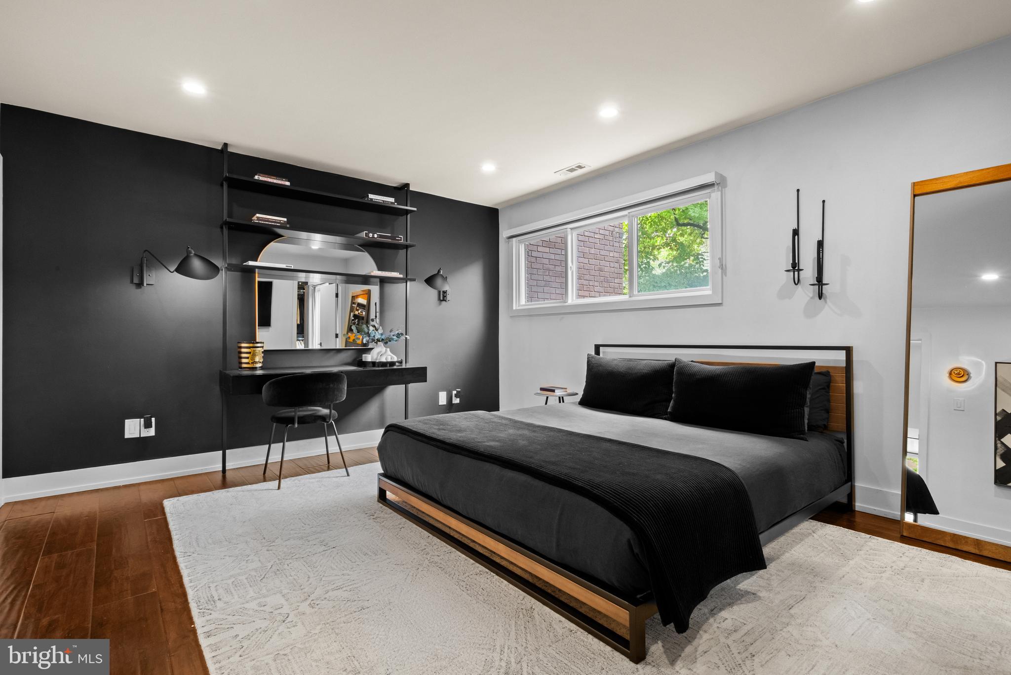 502 Delancey Street, Unit A Philadelphia, PA 19106 - Photo 17 of 32 a bedroom with a bed and a table