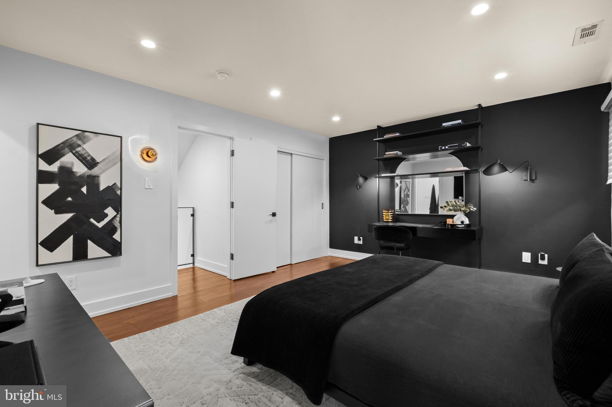 502 Delancey Street, Unit A Philadelphia, PA 19106 - Photo 19 of 32 a bedroom with a bed and a walk in closet