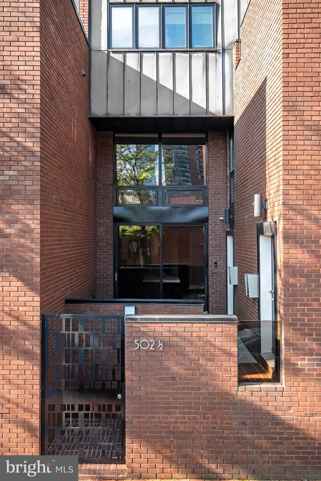 502 Delancey Street, Unit A Philadelphia, PA 19106 - Photo 2 of 32 a view of building with a window and brick walls