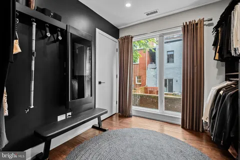 a bathroom with a shower sink and mirror