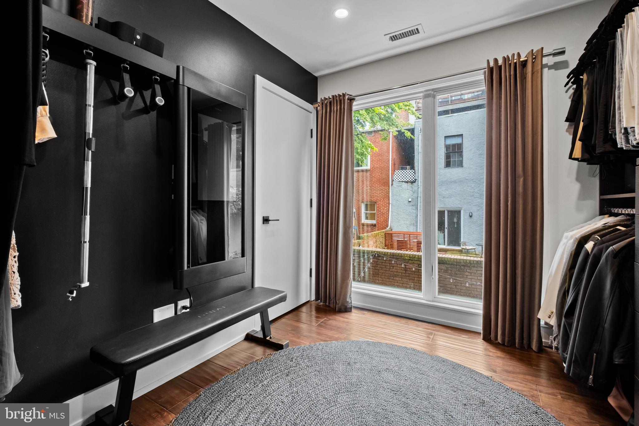 502 Delancey Street, Unit A Philadelphia, PA 19106 - Photo 22 of 32 a living room with a furniture and a flat screen tv