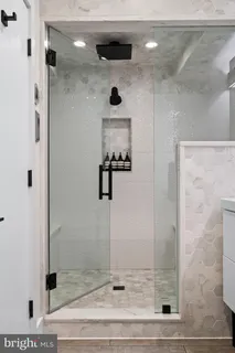 a bedroom with a bed lamp and window