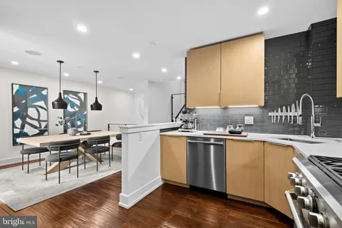 a kitchen with a refrigerator stove and microwave