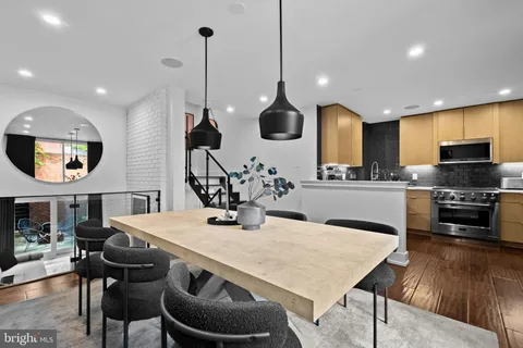 a view of a dining hall with furniture and wooden floor