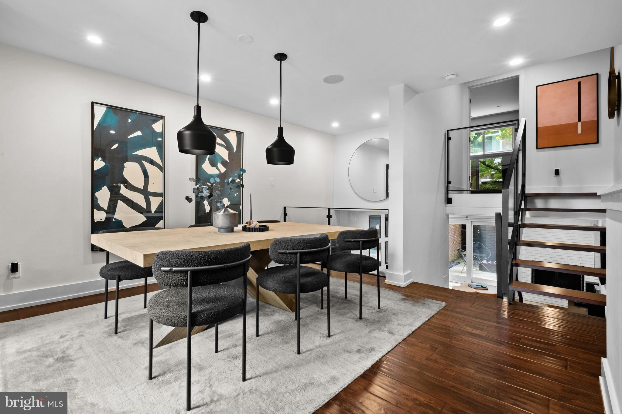 502 Delancey Street, Unit A Philadelphia, PA 19106 - Photo 9 of 32 a view of a dining hall with furniture and wooden floor