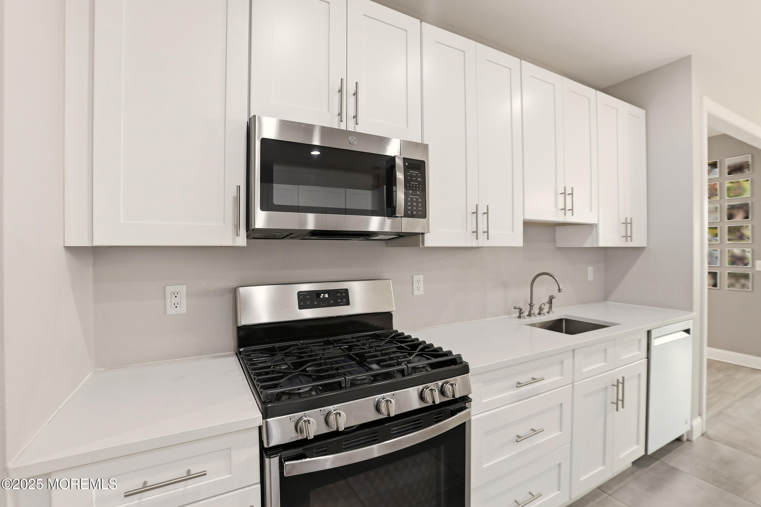 119 North Zinfandel Road Lakewood, NJ 08701 - Photo 15 of 29 a kitchen with white cabinets and appliances
