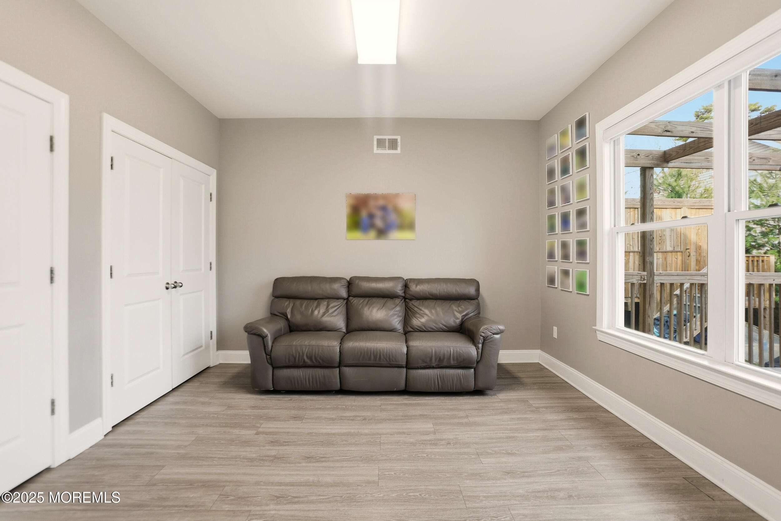 119 North Zinfandel Road Lakewood, NJ 08701 - Photo 17 of 29 a living room with furniture and a large window