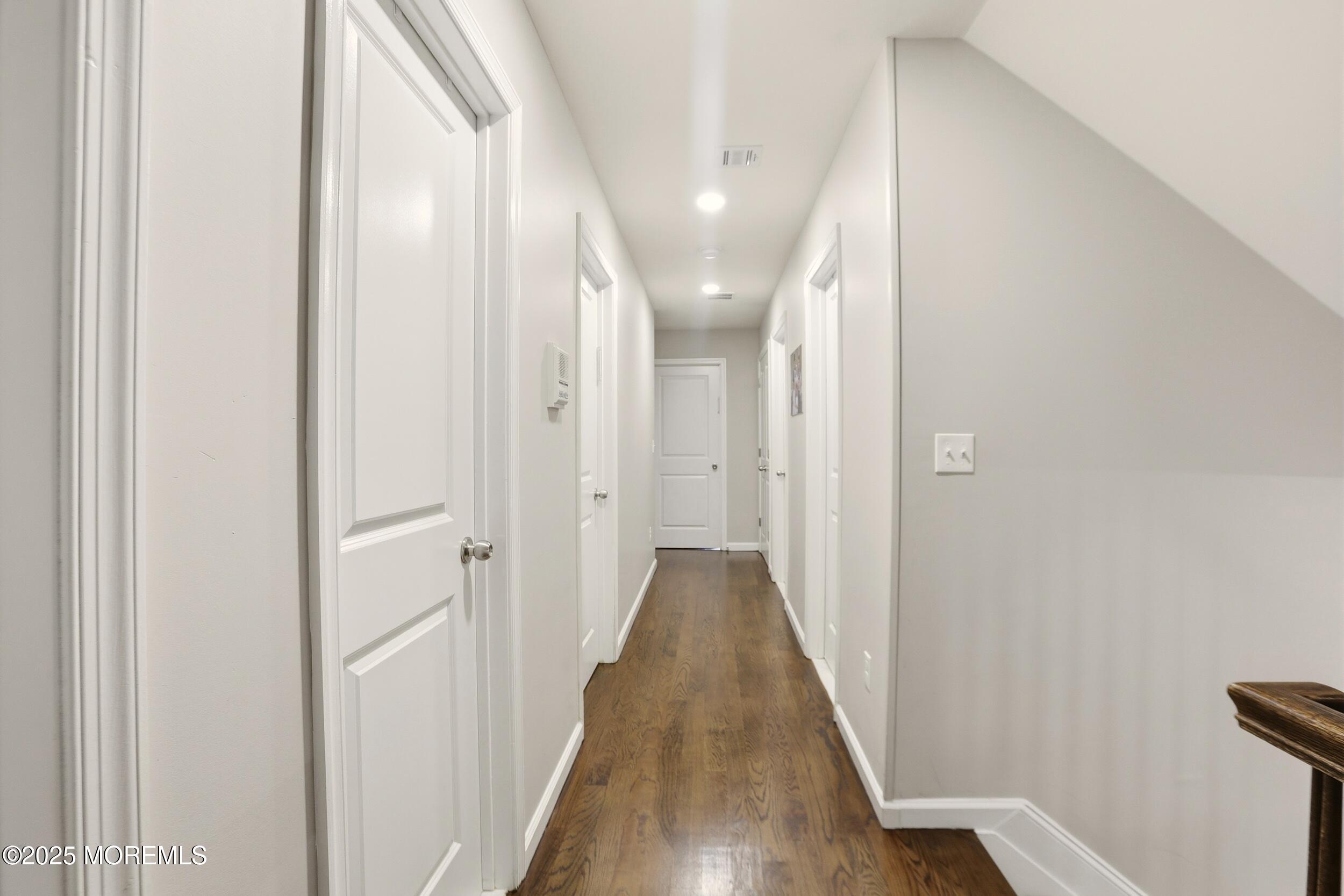 119 North Zinfandel Road Lakewood, NJ 08701 - Photo 18 of 29 a view of a hallway with wooden floor